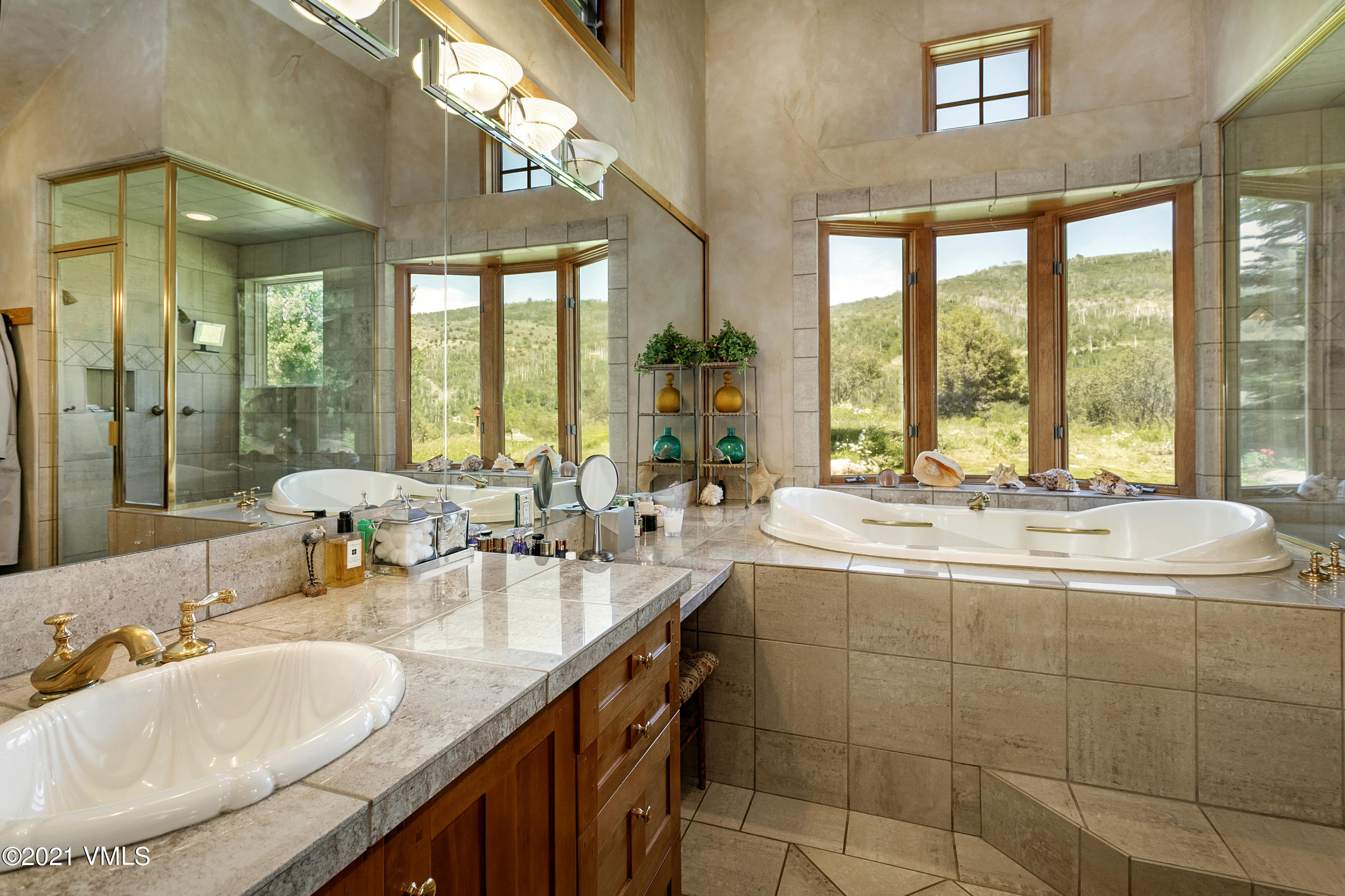 755 Eagle Crest Road Edwards, CO 81632 - Photo 21 of 56 a bathroom with a granite countertop sink and a large mirror