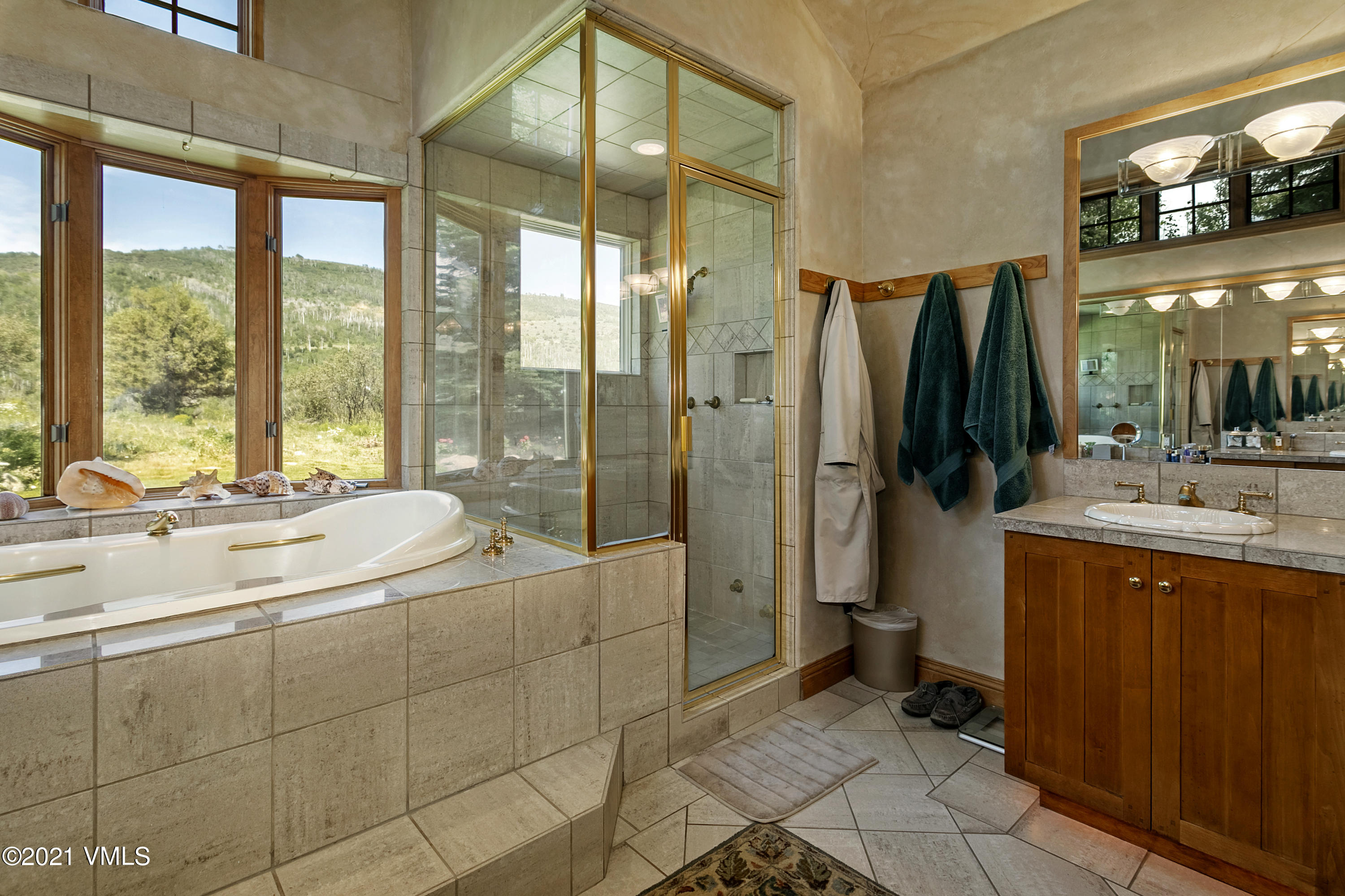 755 Eagle Crest Road Edwards, CO 81632 - Photo 22 of 56 a bathroom with a granite countertop sink a toilet and shower
