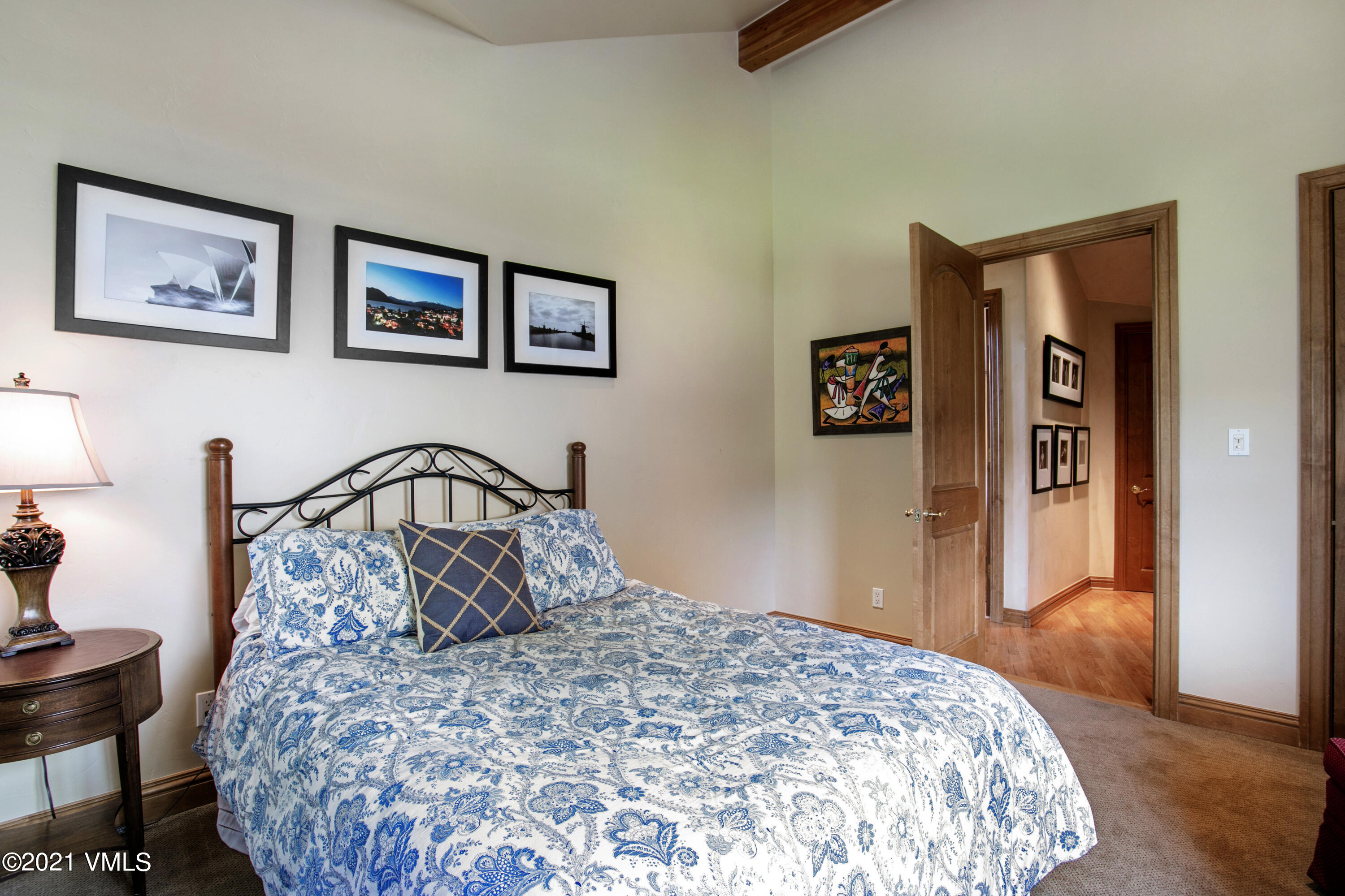 755 Eagle Crest Road Edwards, CO 81632 - Photo 23 of 56 a bedroom with a large bed and a dresser