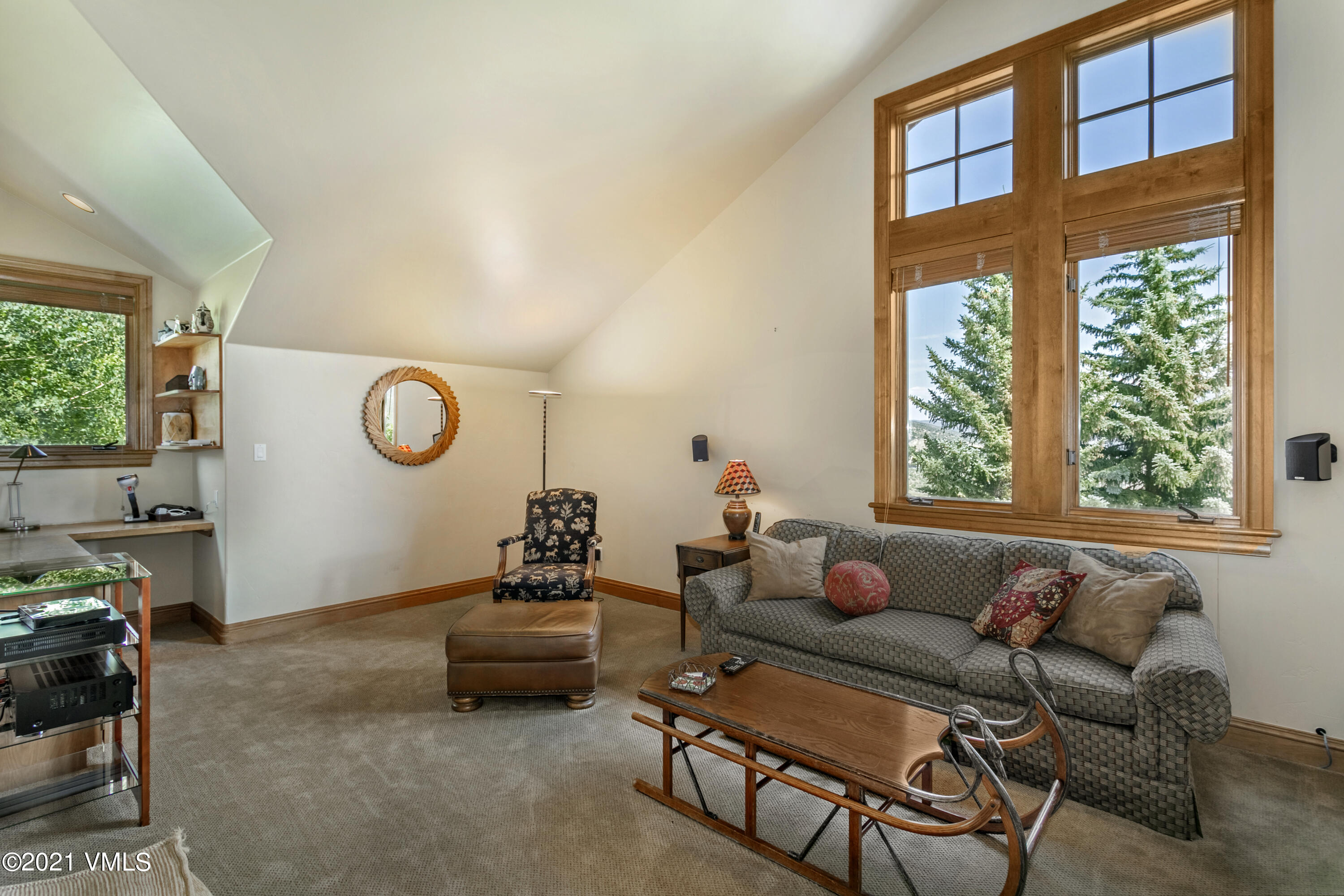755 Eagle Crest Road Edwards, CO 81632 - Photo 25 of 56 a living room with furniture and a large window