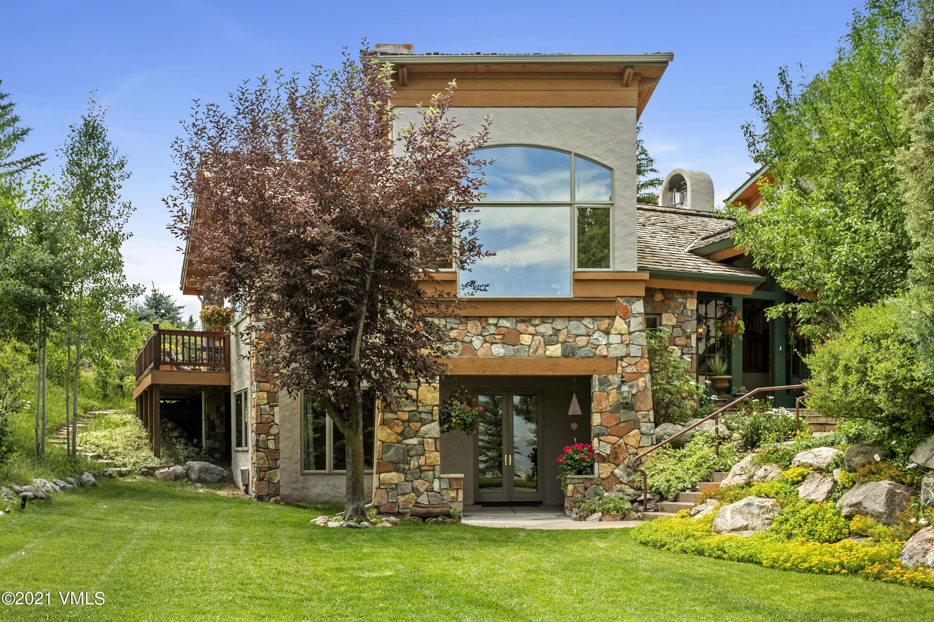 755 Eagle Crest Road Edwards, CO 81632 - Photo 3 of 56 a front view of a house with a yard