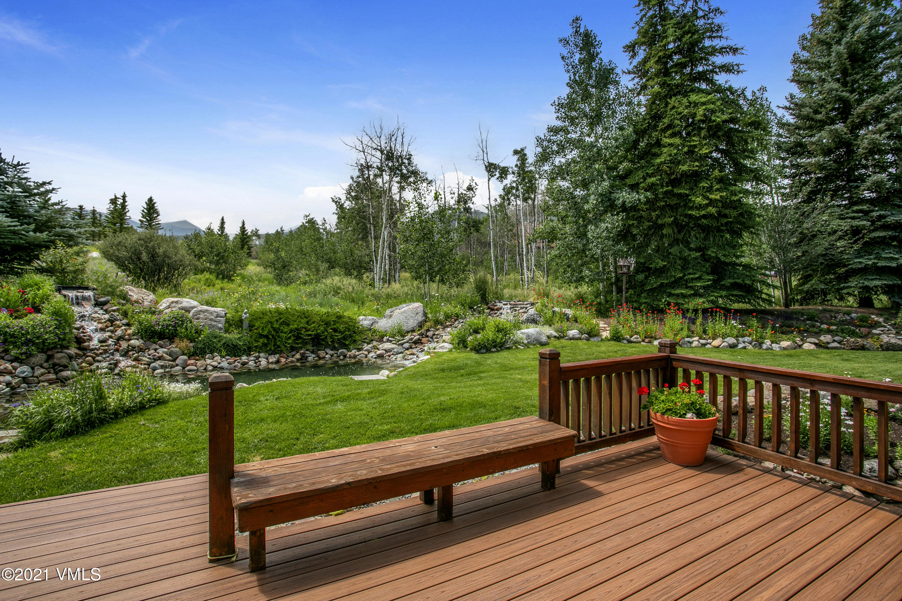 755 Eagle Crest Road Edwards, CO 81632 - Photo 42 of 56 a view of a wooden deck with a yard