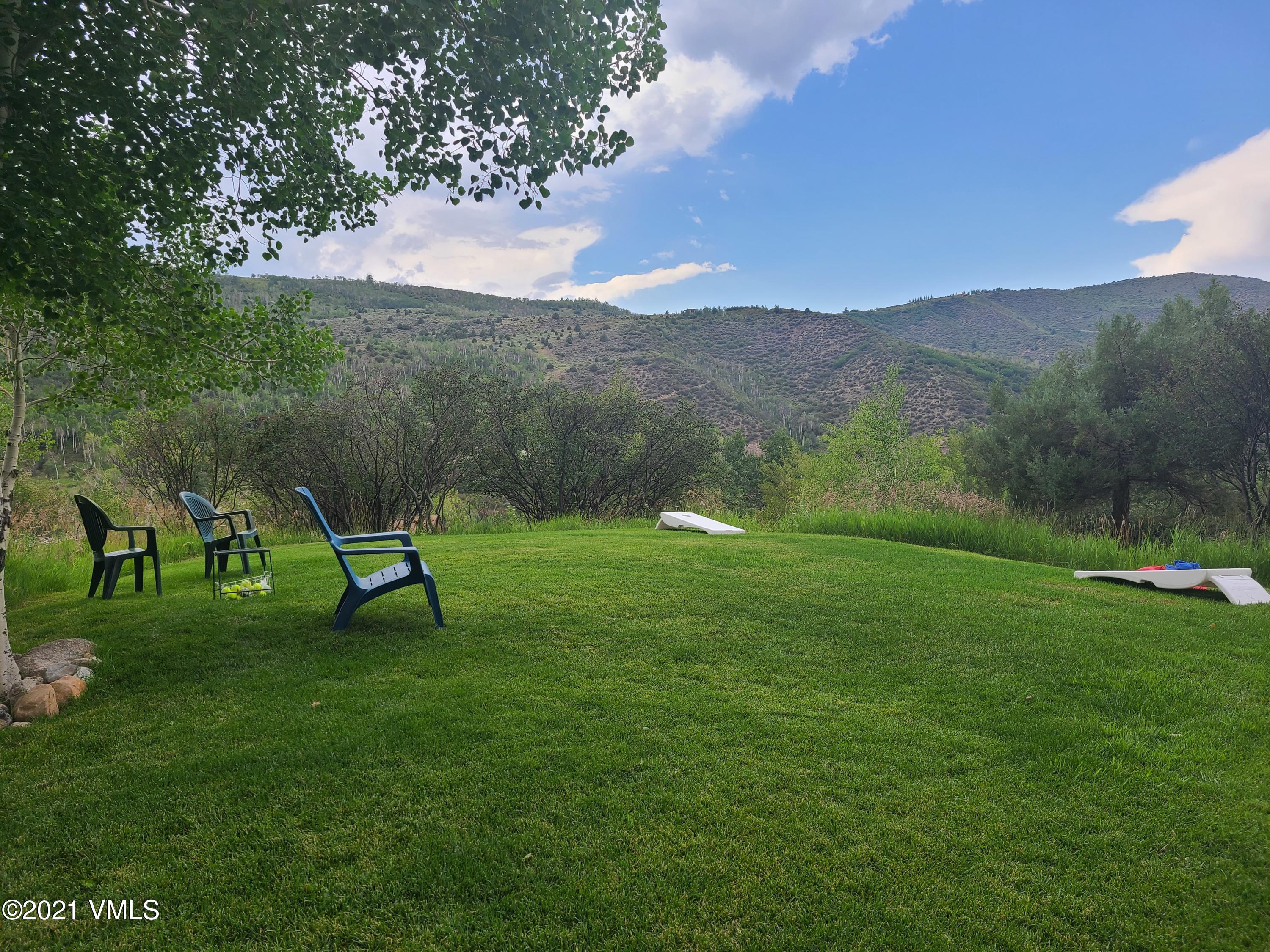 755 Eagle Crest Road Edwards, CO 81632 - Photo 51 of 56 a view of a garden with a bench