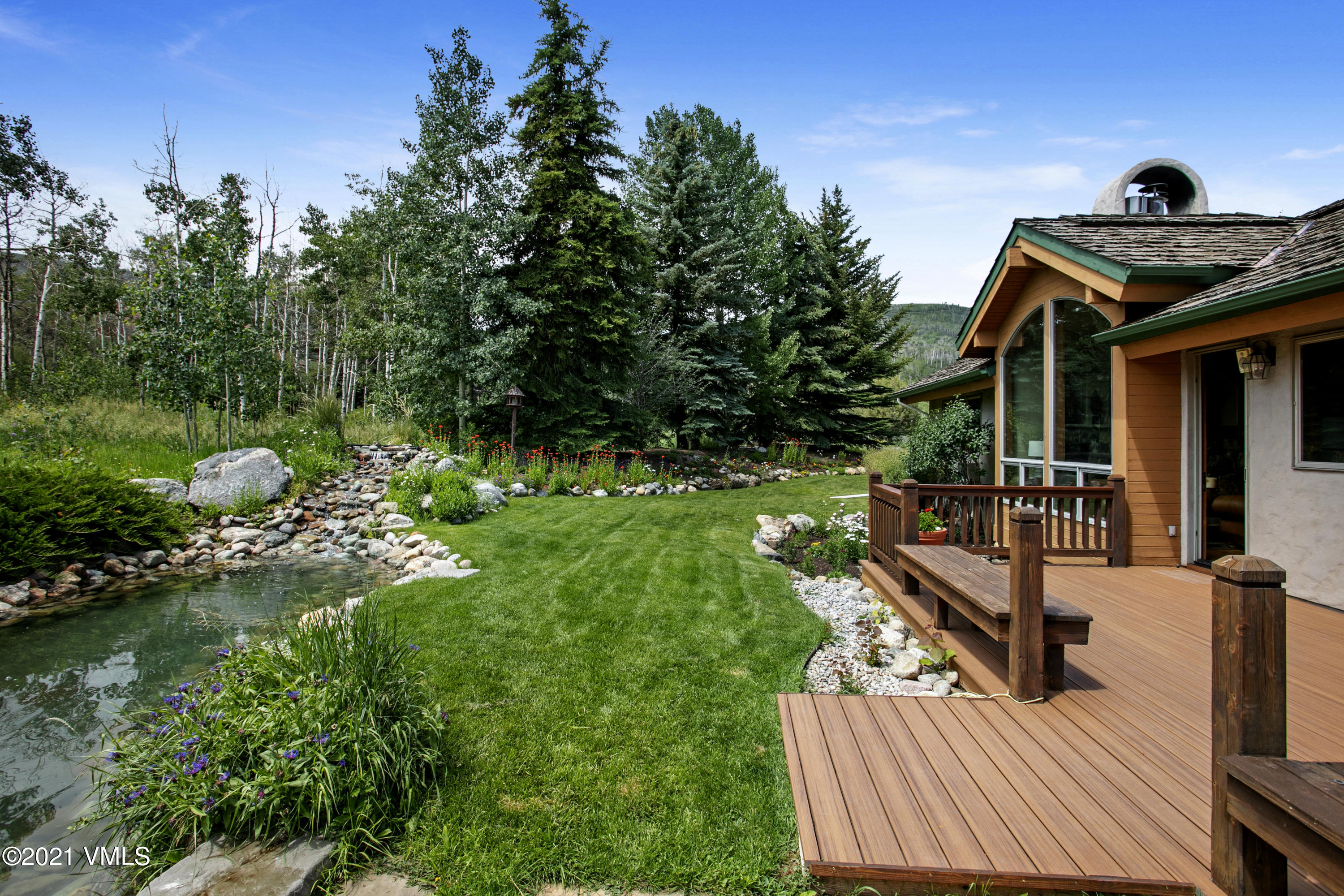 755 Eagle Crest Road Edwards, CO 81632 - Photo 7 of 56 a view of a house with backyard and sitting area