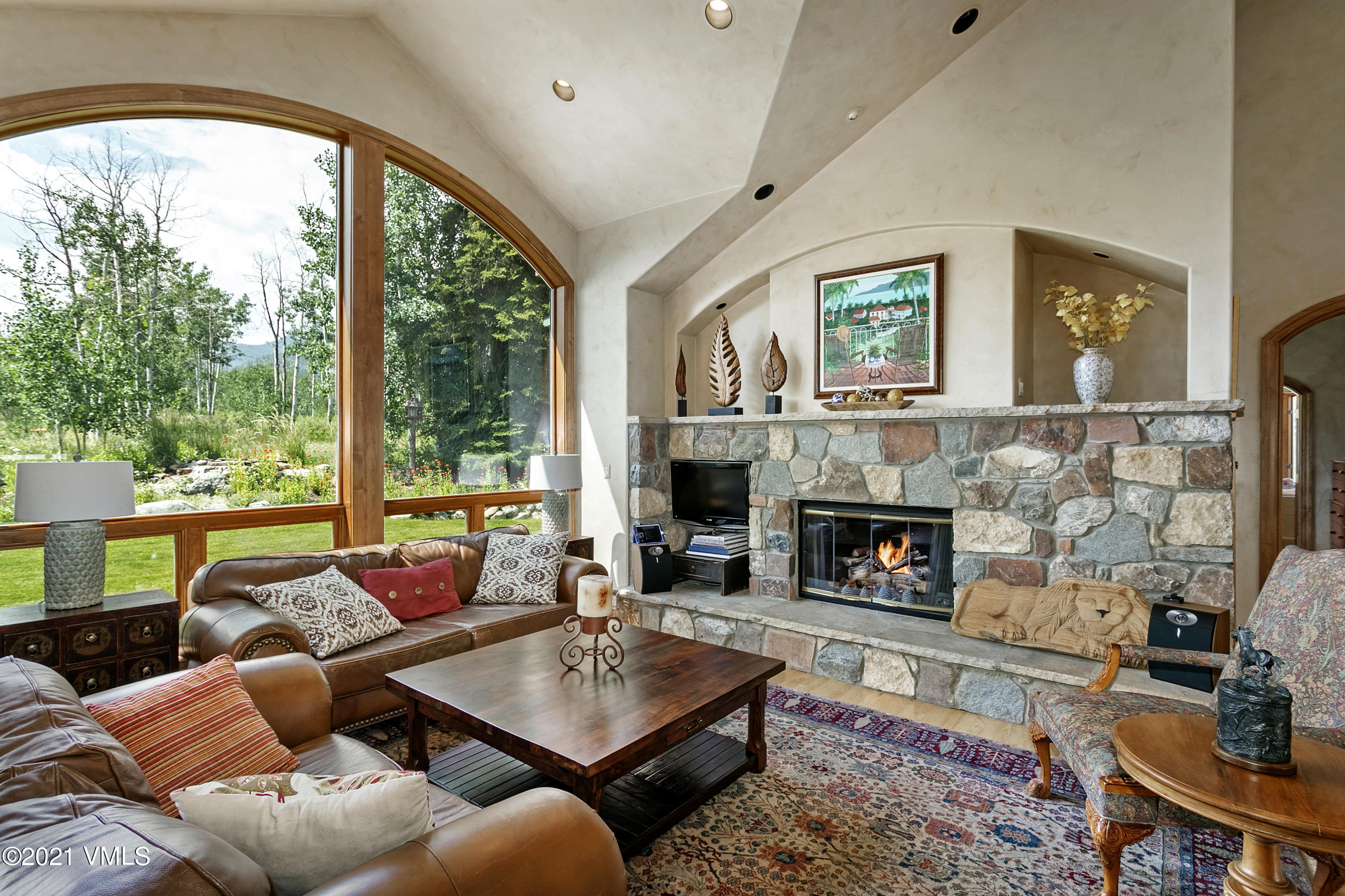 755 Eagle Crest Road Edwards, CO 81632 - Photo 10 of 56 a living room with furniture and a fireplace
