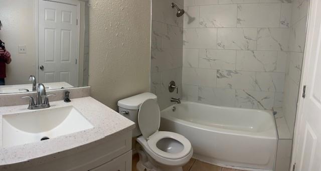 8127 Stonehurst Street, Unit 9 Dallas, TX 75217 - Photo 9 of 12 a bathroom with a sink a toilet and bathtub