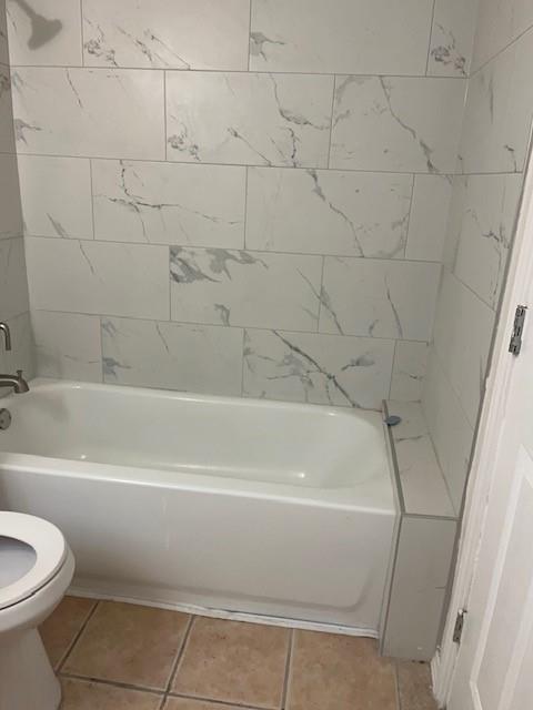 8127 Stonehurst Street, Unit 9 Dallas, TX 75217 - Photo 10 of 12 a bathroom with a bathtub and a toilet