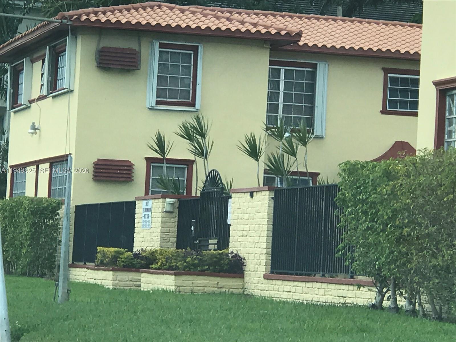 661 Southwest 11th Street, Unit 22W Miami, FL 33129 - Photo 2 of 22 a front view of a house with garden