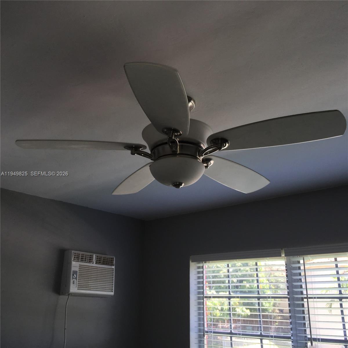 661 Southwest 11th Street, Unit 22W Miami, FL 33129 - Photo 9 of 22 a room with furniture and a window