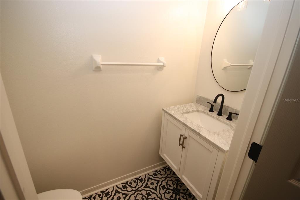 1575 Blue Magnolia Road Brandon, FL 33510 - Photo 12 of 22 a bathroom with a sink and a mirror