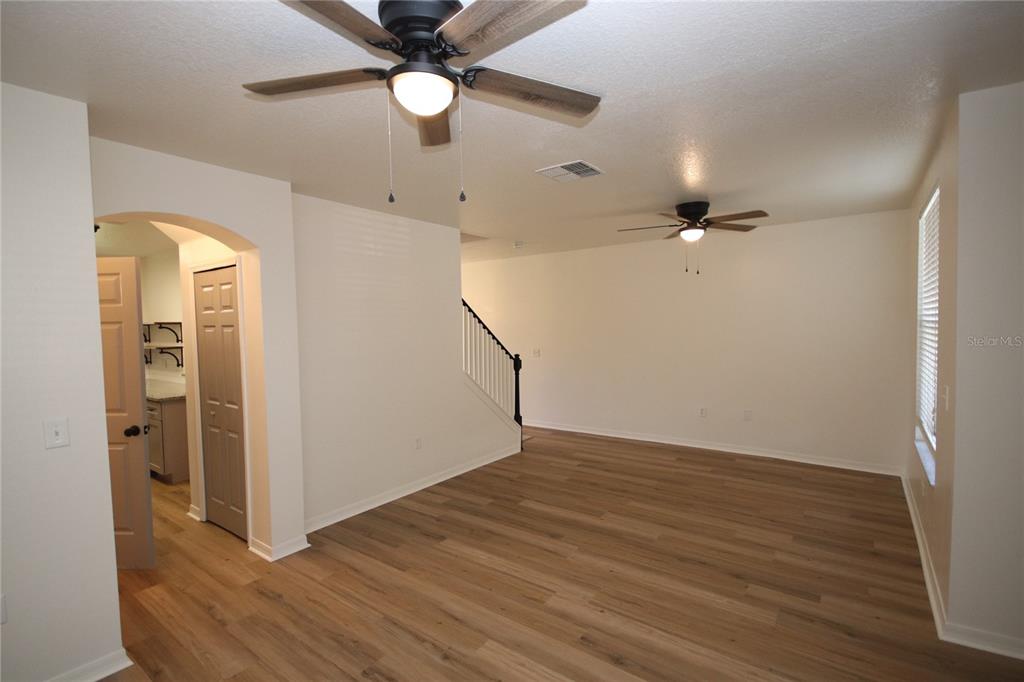 1575 Blue Magnolia Road Brandon, FL 33510 - Photo 14 of 22 wooden floor in an empty room with a window