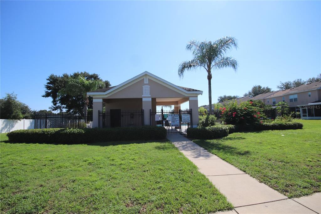 1575 Blue Magnolia Road Brandon, FL 33510 - Photo 18 of 22 a front view of a house with garden