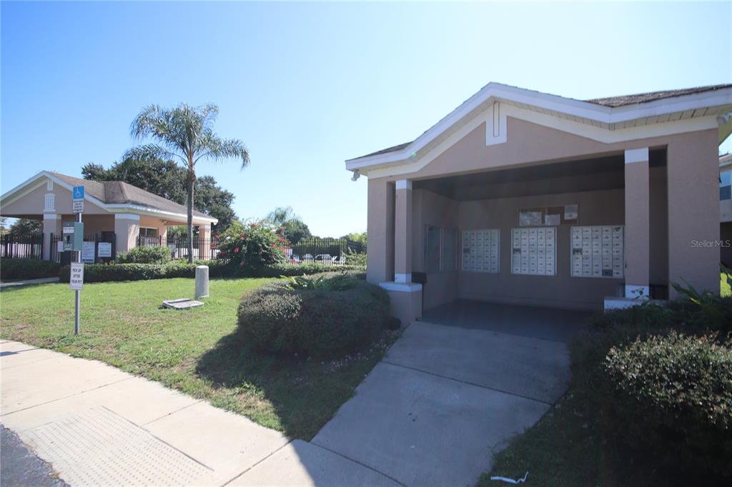 1575 Blue Magnolia Road Brandon, FL 33510 - Photo 20 of 22 a front view of a house with a yard