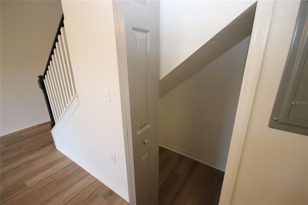 1575 Blue Magnolia Road Brandon, FL 33510 - Photo 22 of 22 a view of a hallway with wooden floor and staircase
