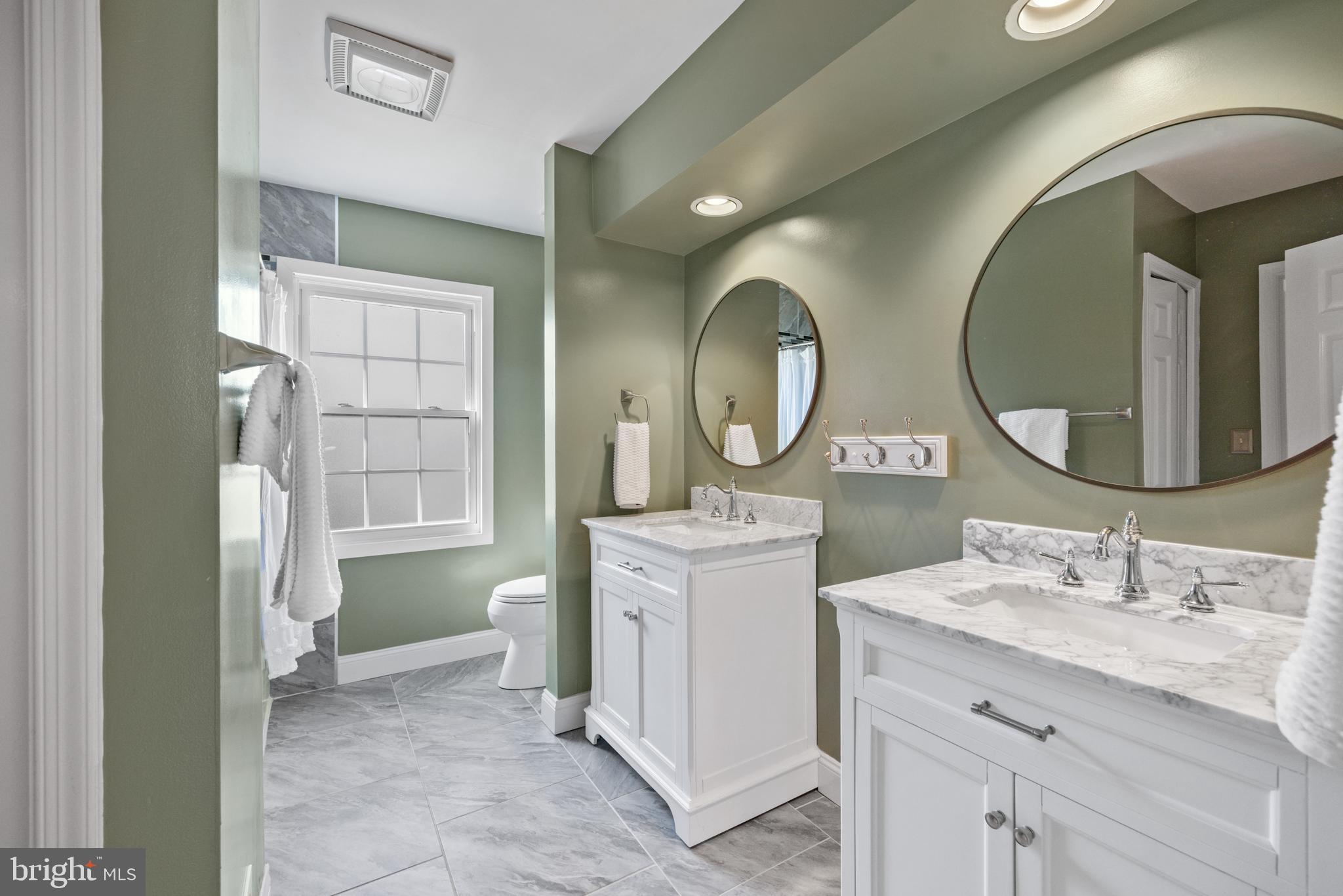 8255 Colling Ridge Court Alexandria, VA 22308 - Photo 28 of 49 Shared hall bath with dual sinks