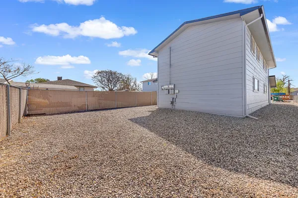 a view of a backyard of the house
