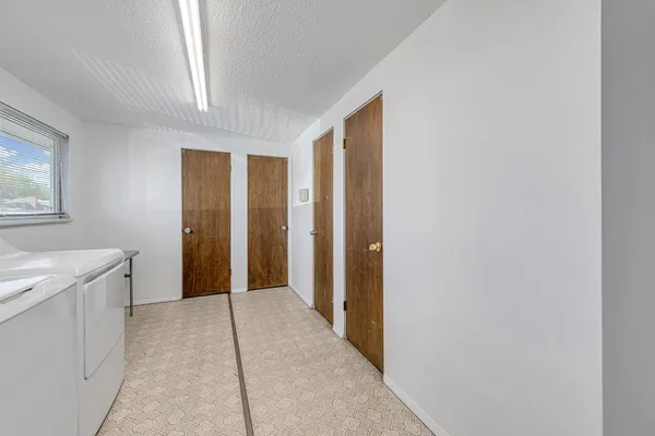 an aerial view of a house with garden space and ocean view