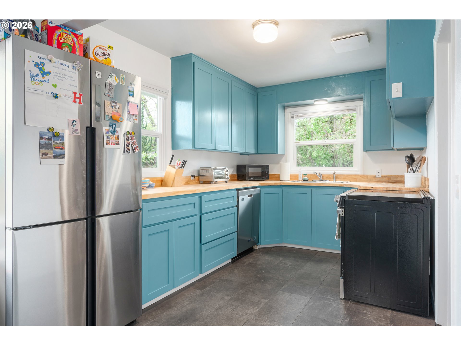 1280 Bailey Avenue Eugene, OR 97402 - Photo 12 of 42 a kitchen with a refrigerator and a sink