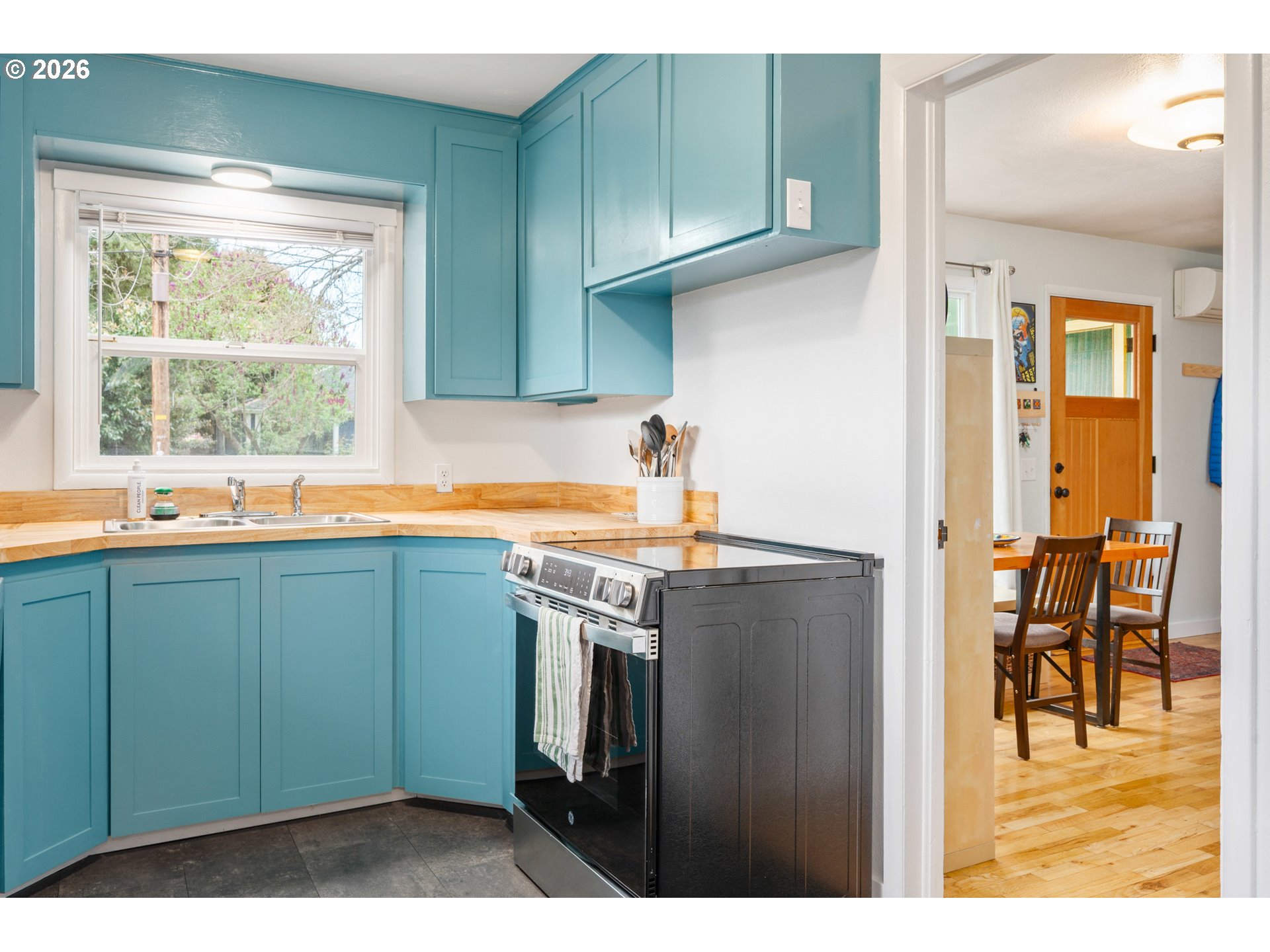 1280 Bailey Avenue Eugene, OR 97402 - Photo 13 of 42 a kitchen with stainless steel appliances granite countertop a refrigerator and a sink