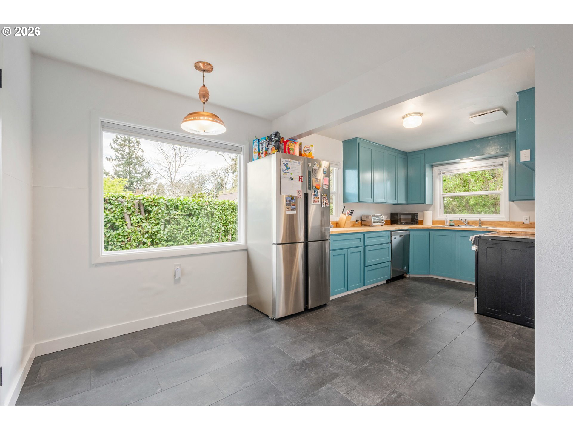 1280 Bailey Avenue Eugene, OR 97402 - Photo 16 of 42 a kitchen with refrigerator and window