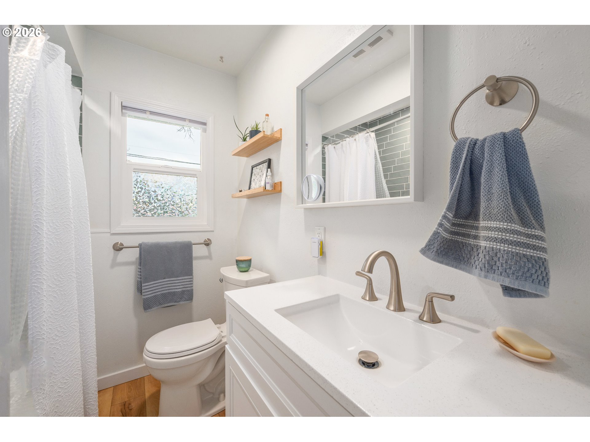 1280 Bailey Avenue Eugene, OR 97402 - Photo 24 of 42 a bathroom with a sink a toilet and mirror