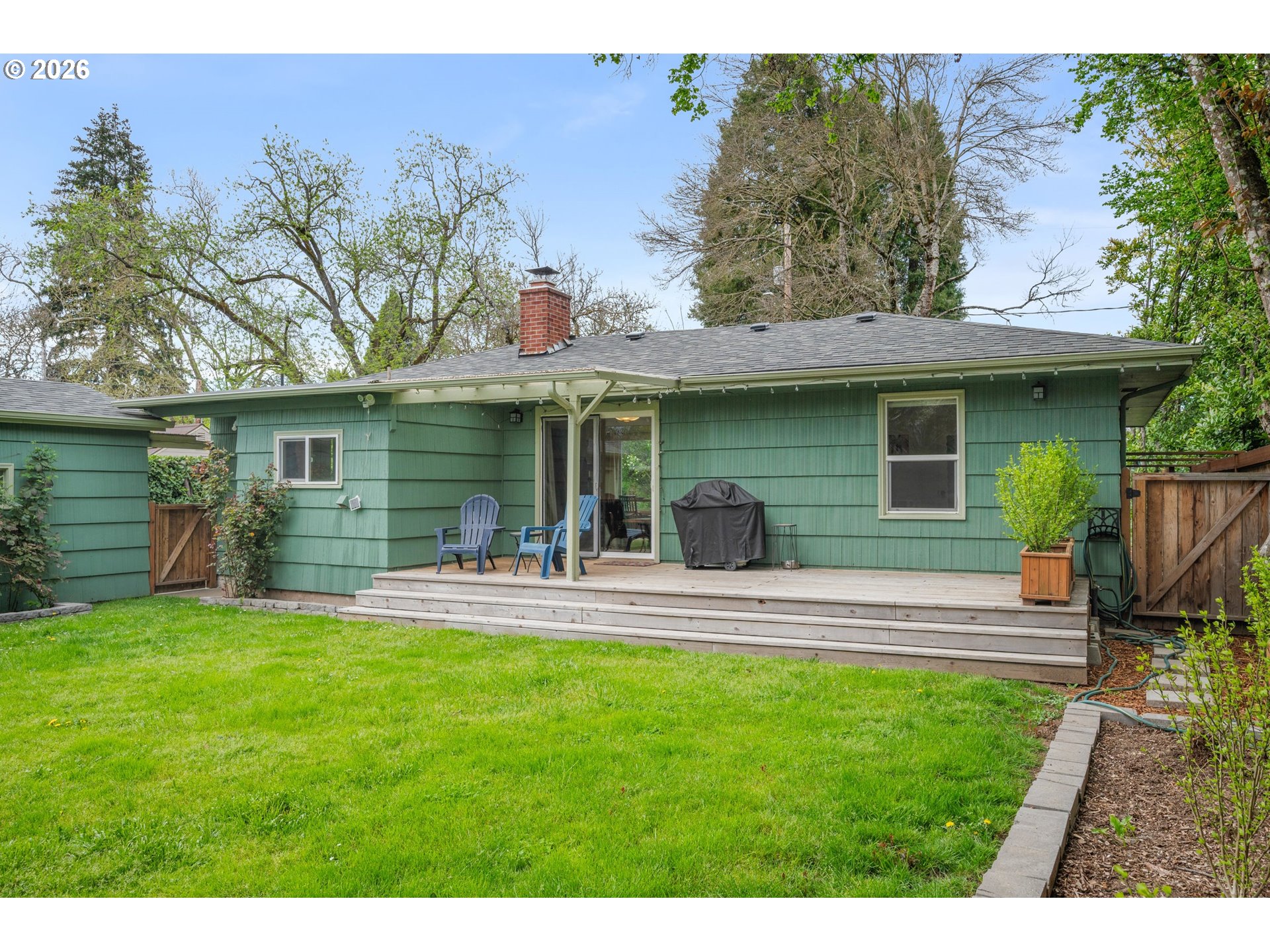 1280 Bailey Avenue Eugene, OR 97402 - Photo 32 of 42 a view of a house with a yard and sitting area