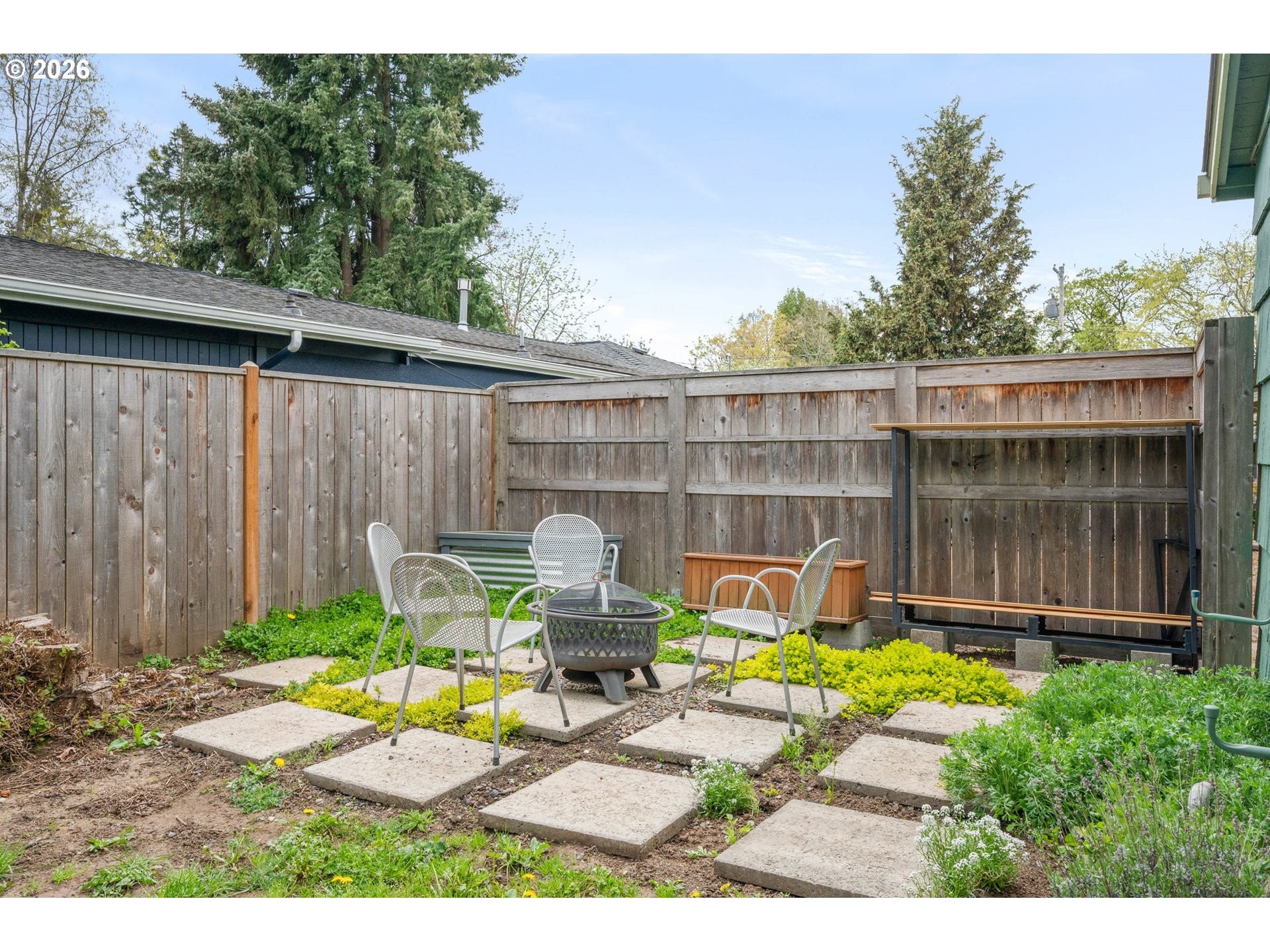 1280 Bailey Avenue Eugene, OR 97402 - Photo 35 of 42 a view of a chair and table in backyard of the house