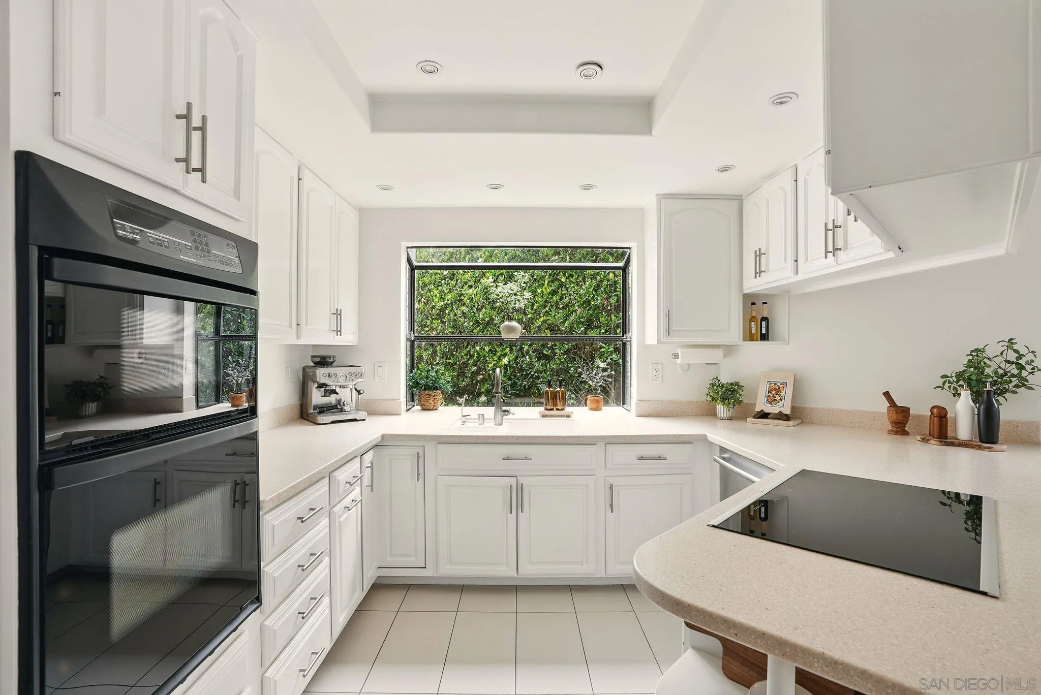 13883 Recuerdo Drive Del Mar, CA 92014 - Photo 26 of 45 a kitchen with a sink stove top oven and microwave