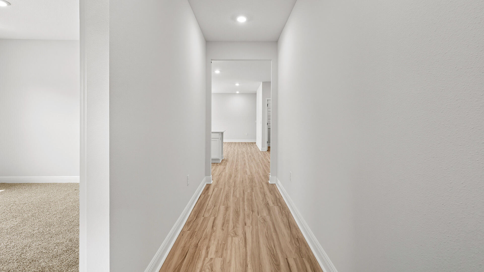 69 Foxtrail Run Freeport, FL 32439 - Photo 7 of 21 a view of a hallway with wooden floor