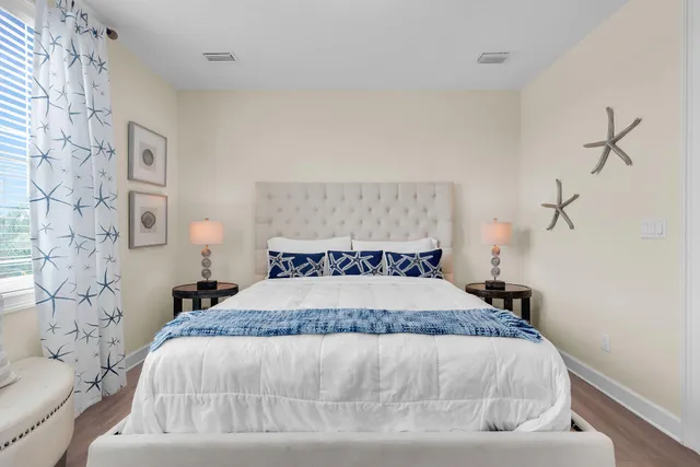 a bedroom with a bed and a view of kitchen
