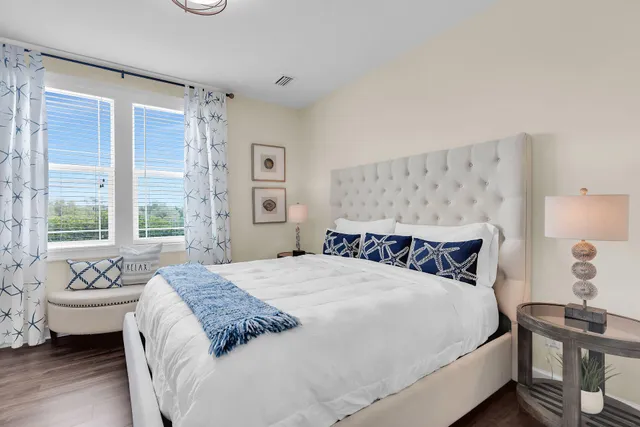 a bedroom with a bed and a bathroom