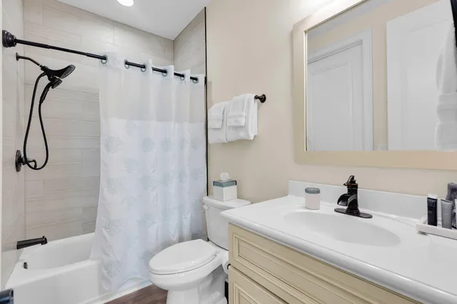 a spacious bedroom with a bed and a window