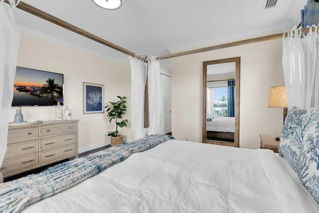 a bathroom with a granite countertop double vanity sink a mirror and shower
