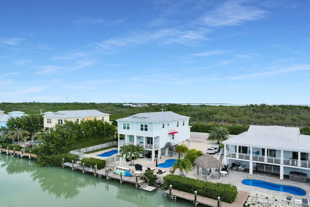 a view of house with garden space and a patio