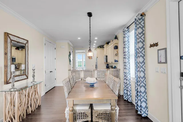 a kitchen with granite countertop a sink a stove and cabinets