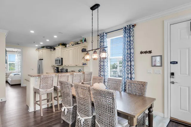 a kitchen with granite countertop a stove sink and refrigerator