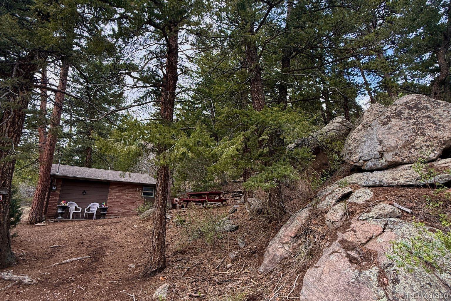 25845 Wilkerson Road Conifer, CO 80433 - Photo 16 of 16 a view of a car park in front of a house