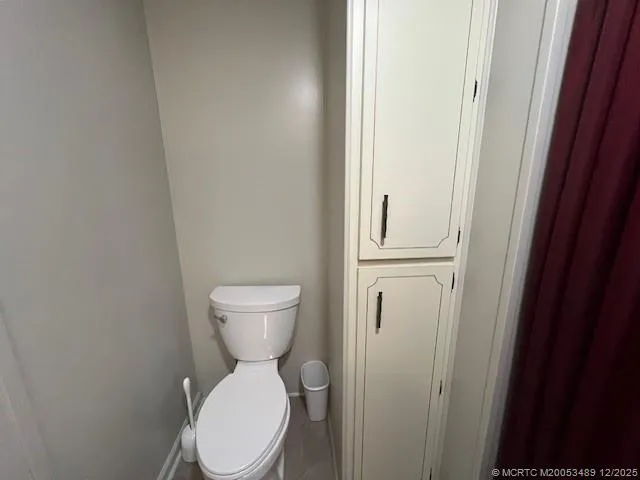 a bathroom with a shower and a curtain