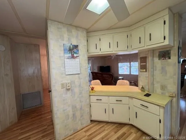 a view of cabinets a washer and dryer