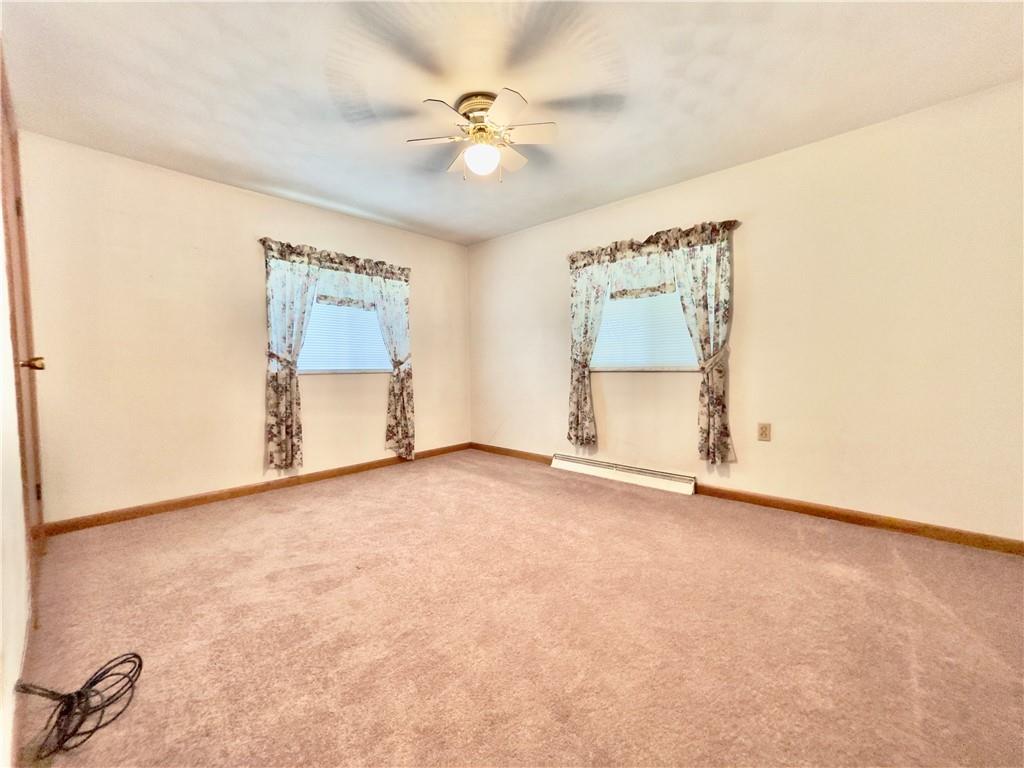 309 Moscow Road Waynesburg, PA 15370 - Photo 13 of 25 an empty room with windows and fan