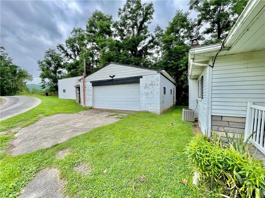 309 Moscow Road Waynesburg, PA 15370 - Photo 21 of 25 a front view of a house with garden
