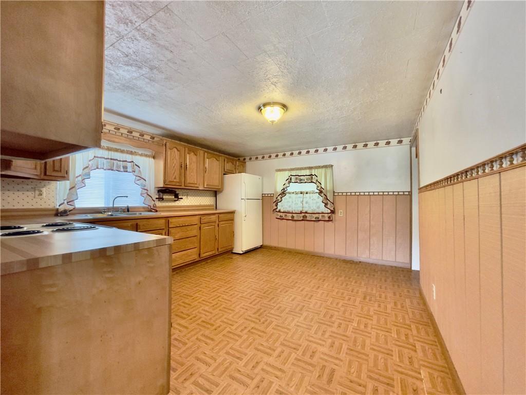 309 Moscow Road Waynesburg, PA 15370 - Photo 7 of 25 a view of a kitchen with microwave and cabinets