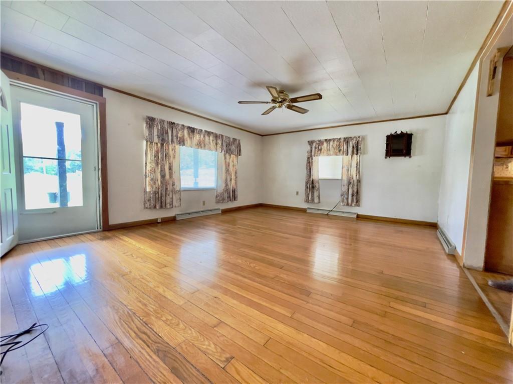 309 Moscow Road Waynesburg, PA 15370 - Photo 8 of 25 a view of empty room with wooden floor and fan
