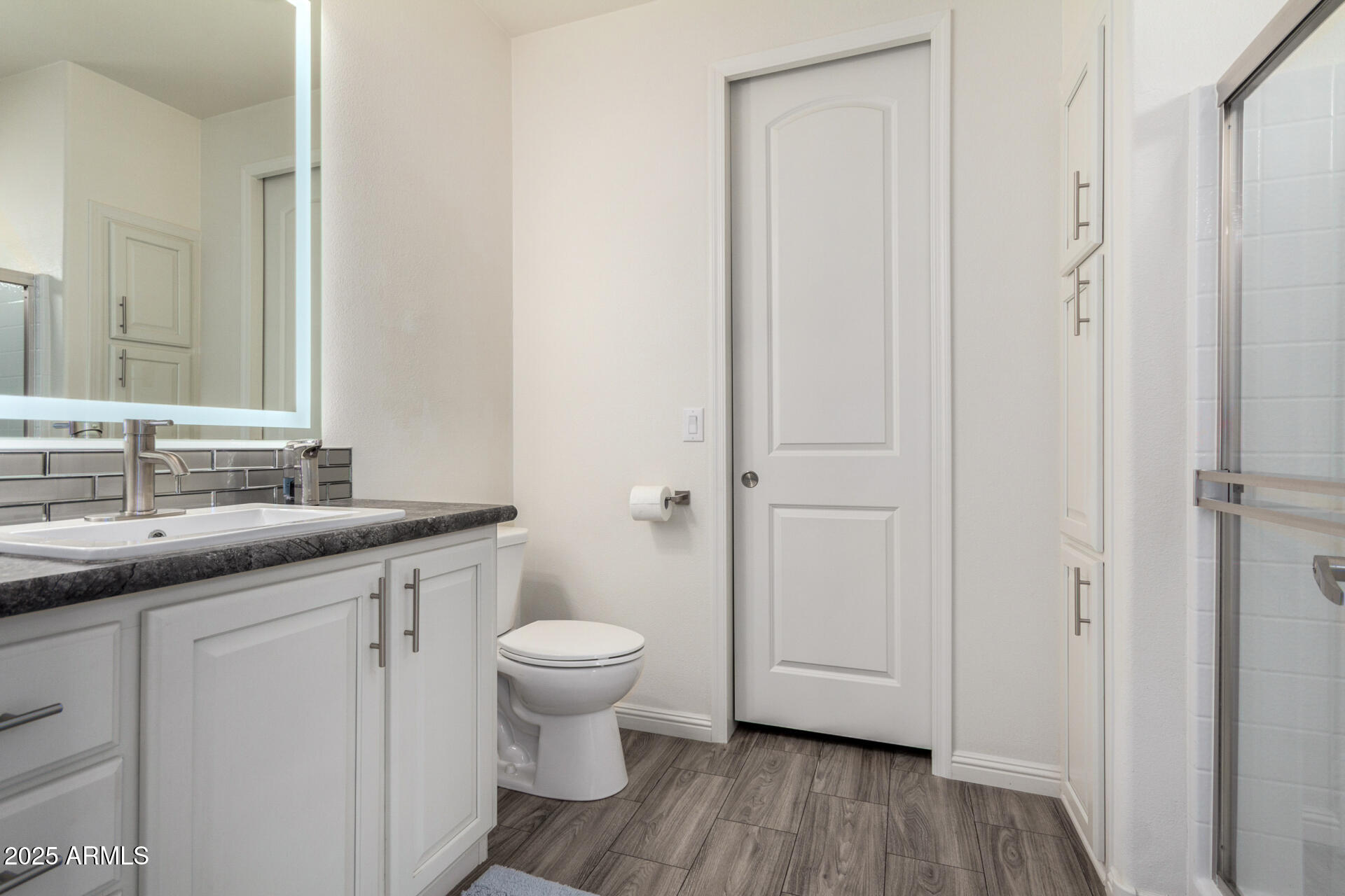 2206 South Ellsworth Road, Unit 103B Mesa, AZ 85209 - Photo 20 of 27 a bathroom with a sink and a mirror