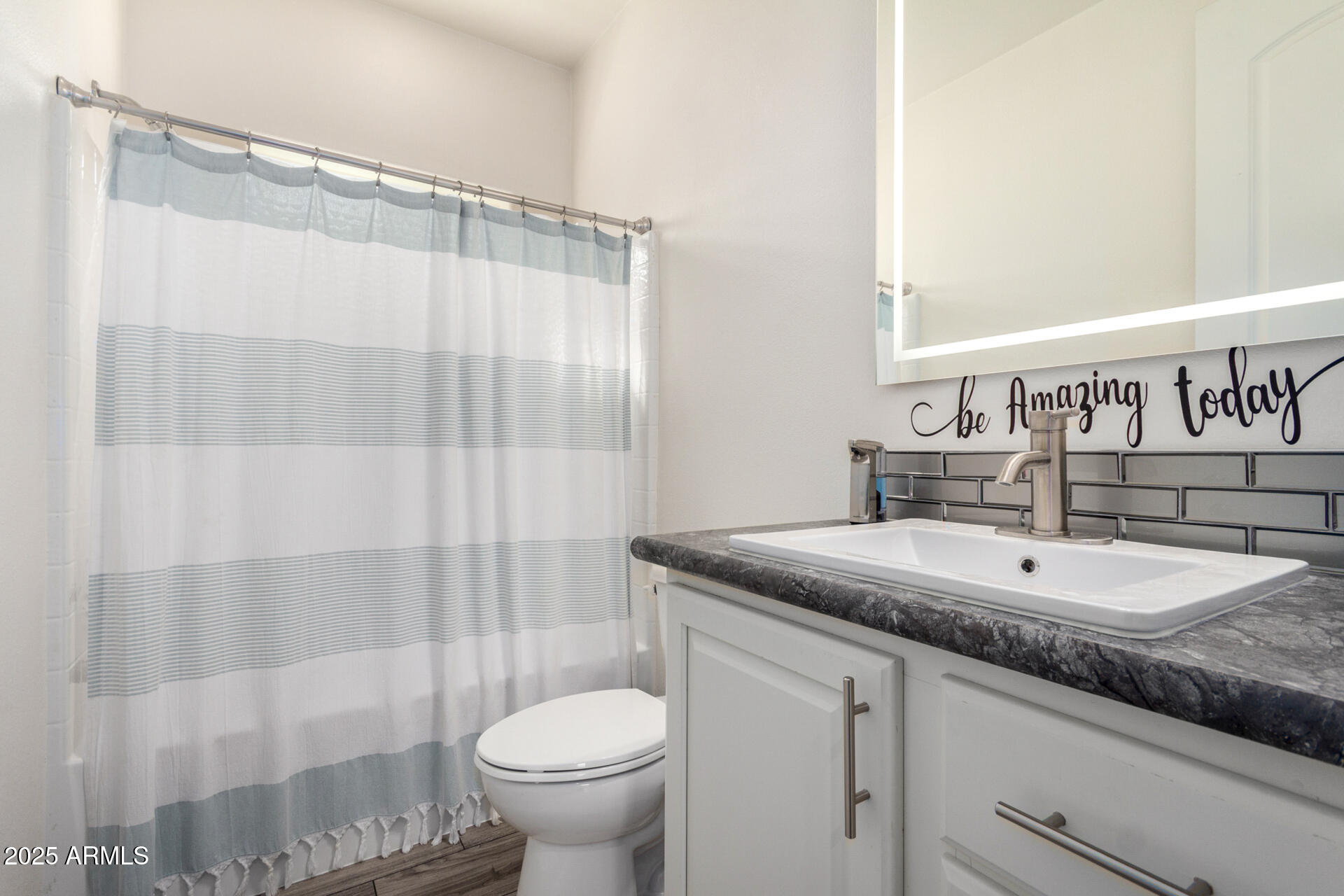 2206 South Ellsworth Road, Unit 103B Mesa, AZ 85209 - Photo 24 of 27 a bathroom with a granite countertop sink toilet and shower
