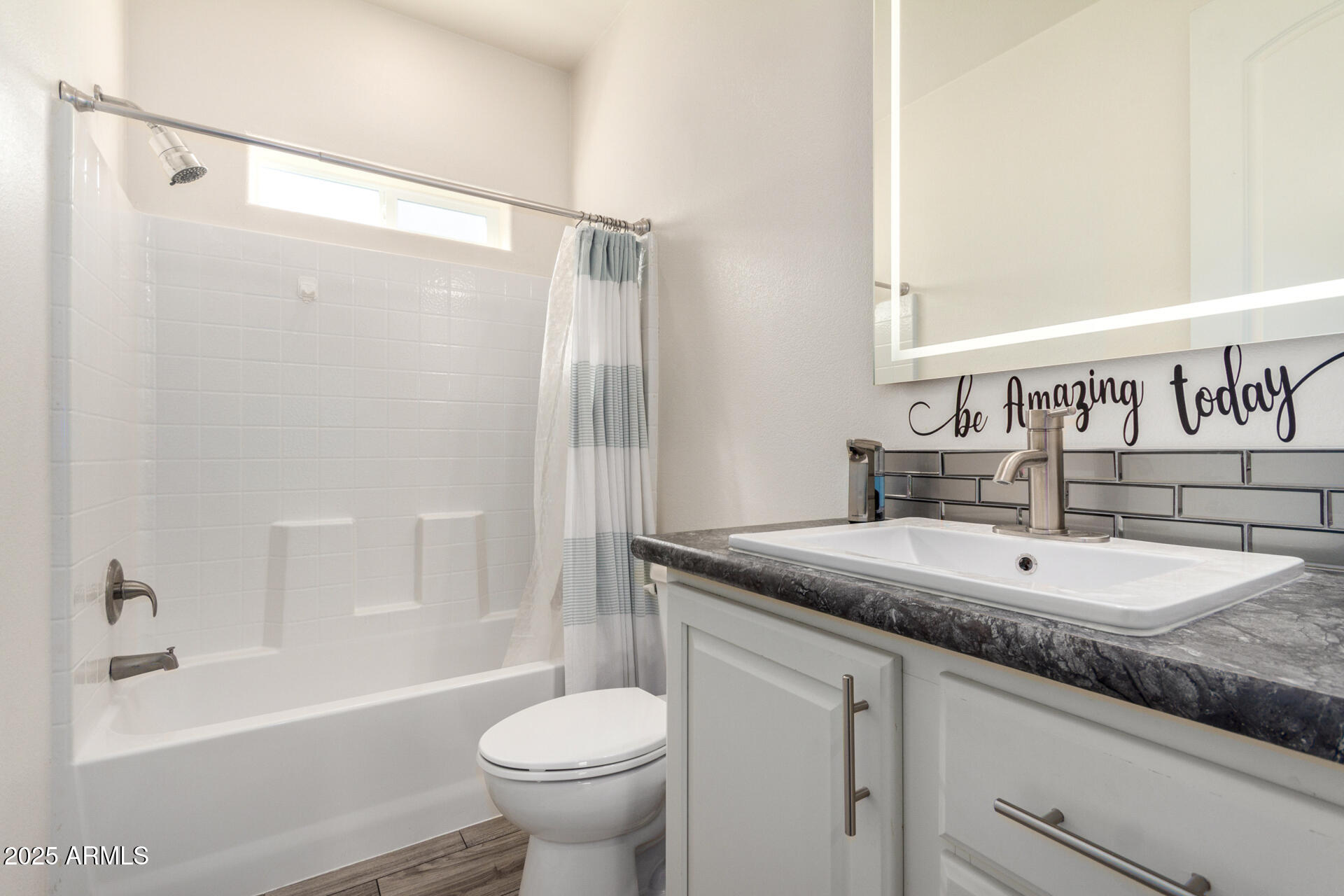 2206 South Ellsworth Road, Unit 103B Mesa, AZ 85209 - Photo 25 of 27 a bathroom with a granite countertop sink toilet and shower