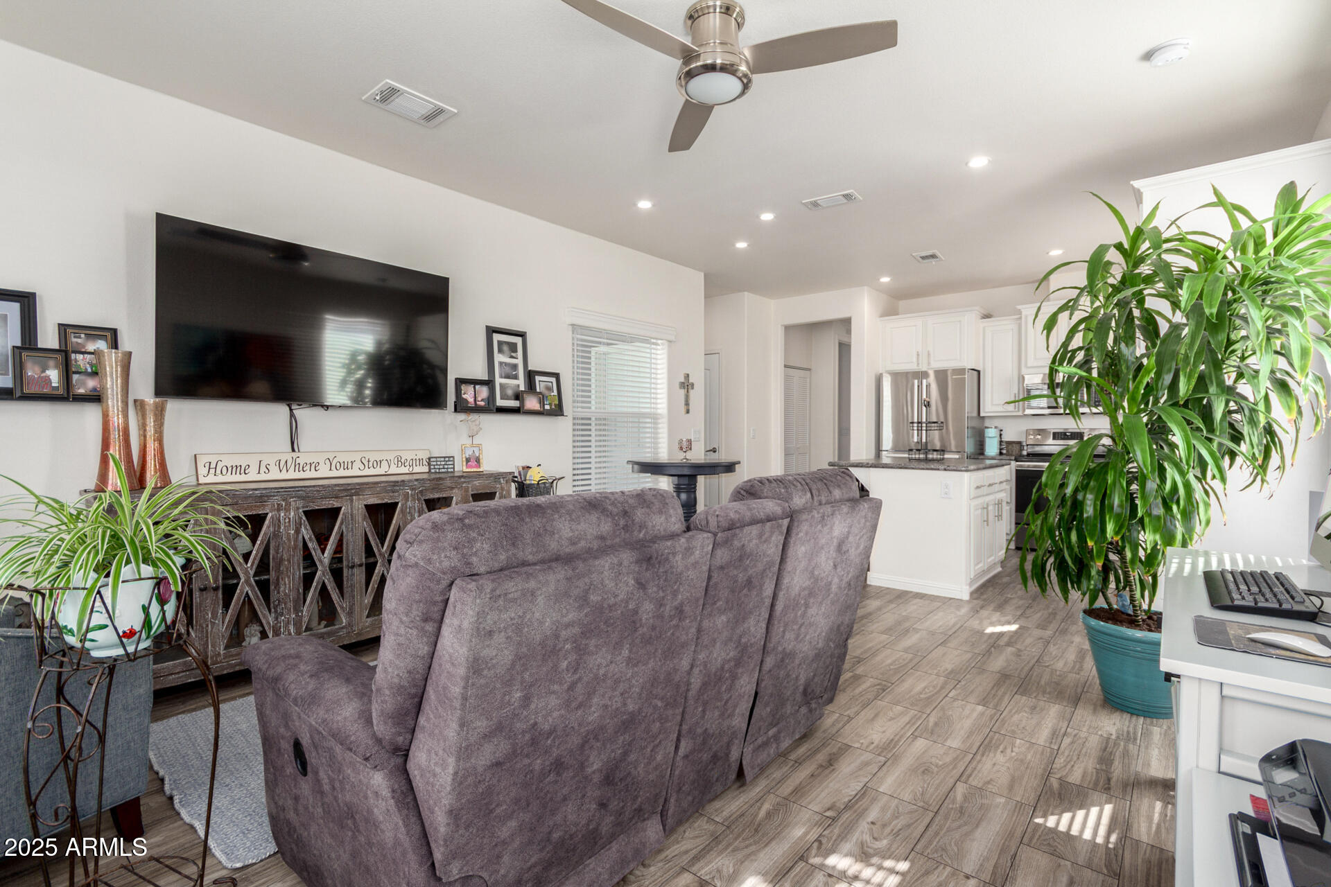 2206 South Ellsworth Road, Unit 103B Mesa, AZ 85209 - Photo 6 of 27 a living room with furniture and a flat screen tv