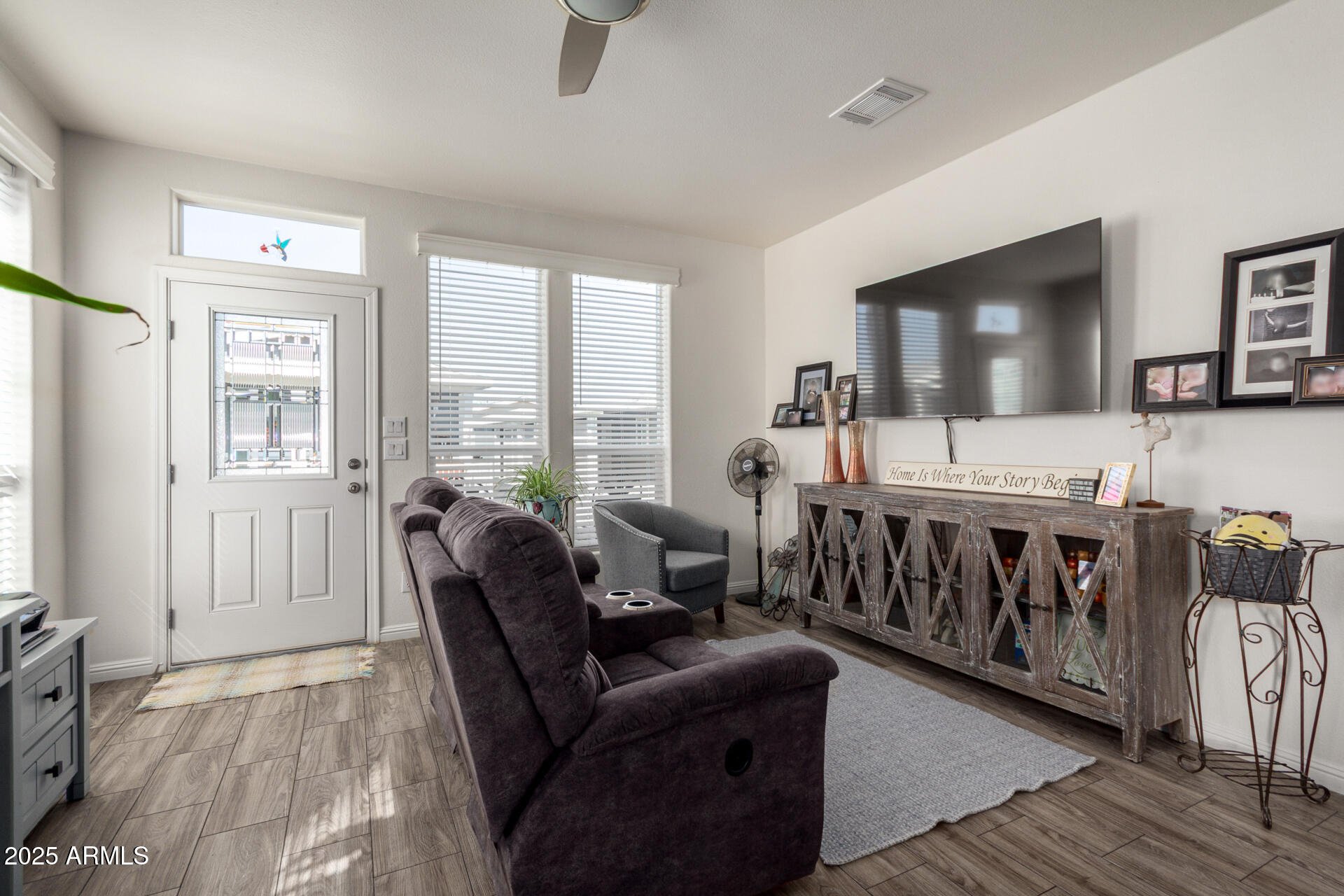 2206 South Ellsworth Road, Unit 103B Mesa, AZ 85209 - Photo 10 of 27 a living room with furniture and a flat screen tv