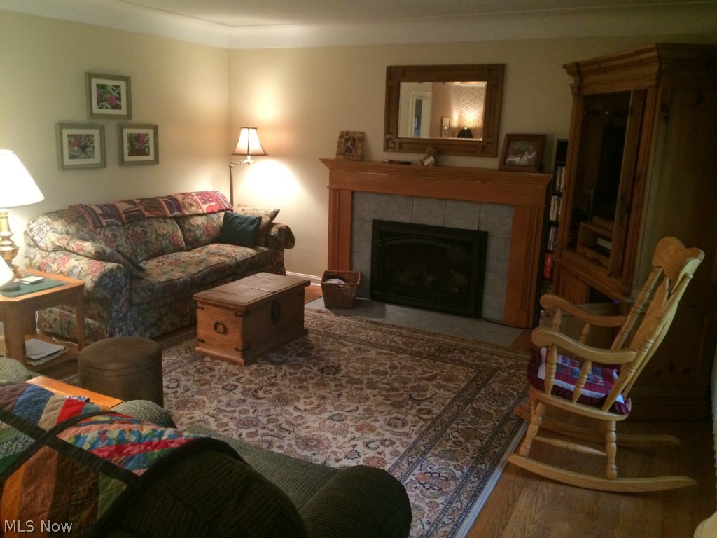 Warm and cozy living room with gas fired fireplace.