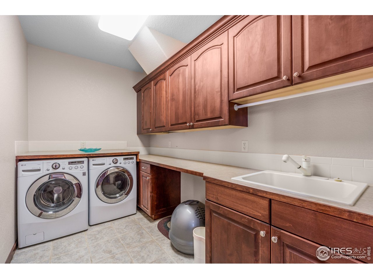 4703 Prairie Ridge Drive Fort Collins, CO 80526 - Photo 16 of 38 Main Floor Laundry Room with Tub Sink